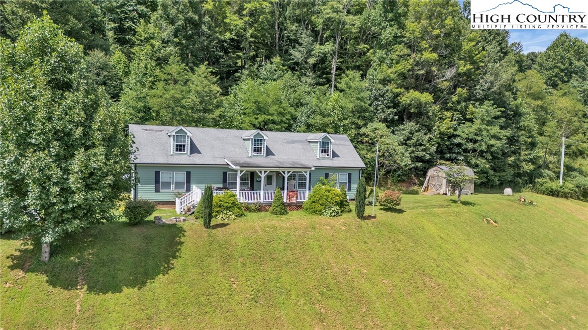 3786 Peak Road Creston, NC 28615 - Photo 44 of 44 a front view of a house with a yard