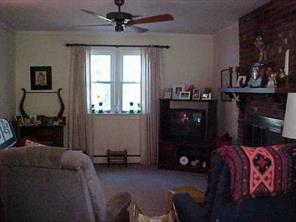 870 Parks Road Woodleaf, NC 27054 - Photo 7 of 8 a living room with furniture and a window