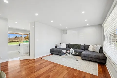 a living room with furniture and a rug