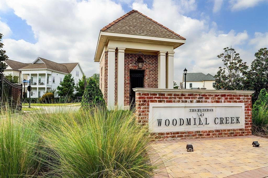 25110 Devlin Creek Drive Spring, TX 77380 - Photo 2 of 8 a view of a sign board with a big yard