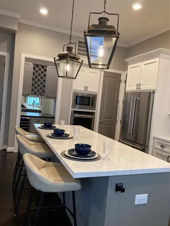 a kitchen with a table and chairs