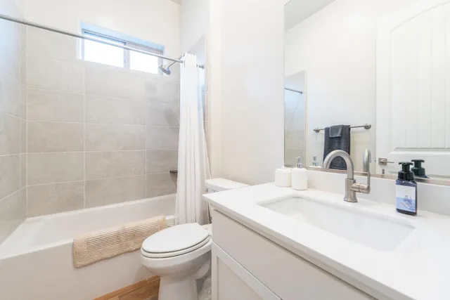 a view of a livingroom with furniture and a flat screen tv