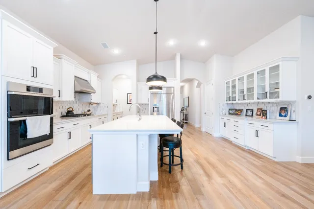 a living room with a flat screen tv and a fireplace