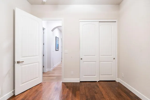 a bathroom with a double vanity sink and mirror