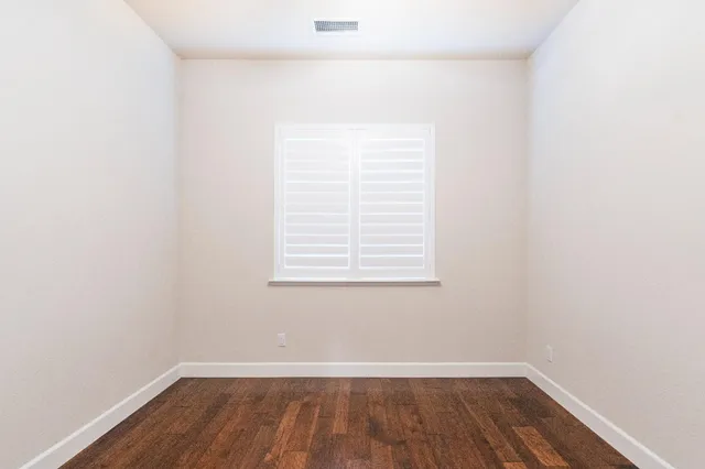 a view of a small space with wooden floor