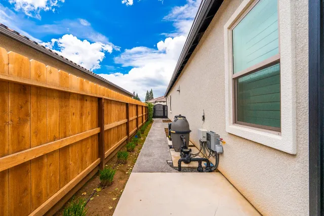 a living room with furniture a city view and large windows