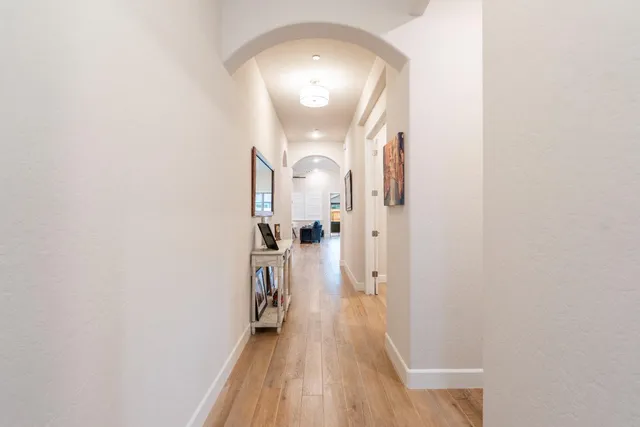 a bed room with a bed and a chandelier
