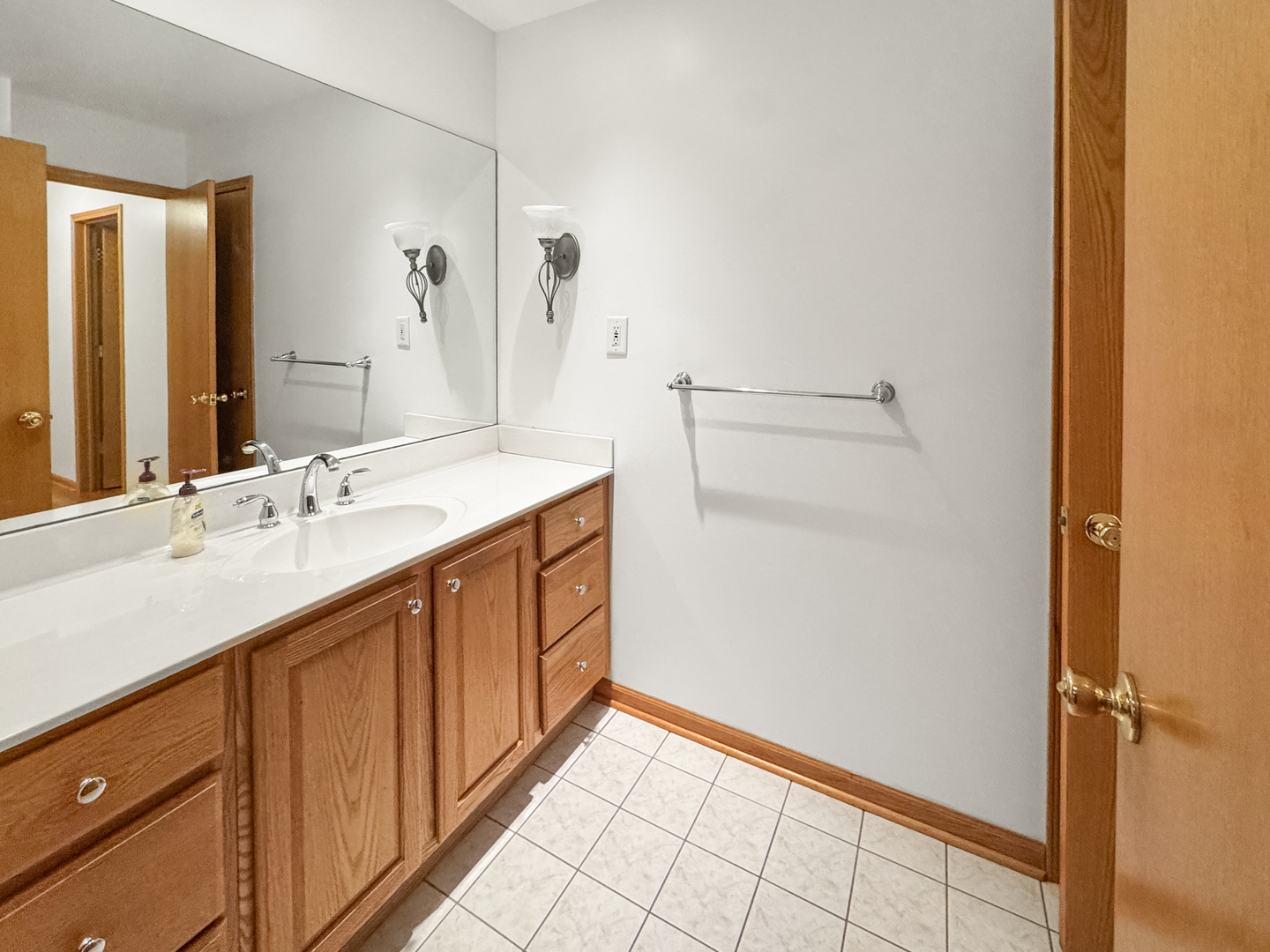 1105 Summit Drive Lockport, IL 60441 - Photo 12 of 15 a bathroom with a sink and a mirror
