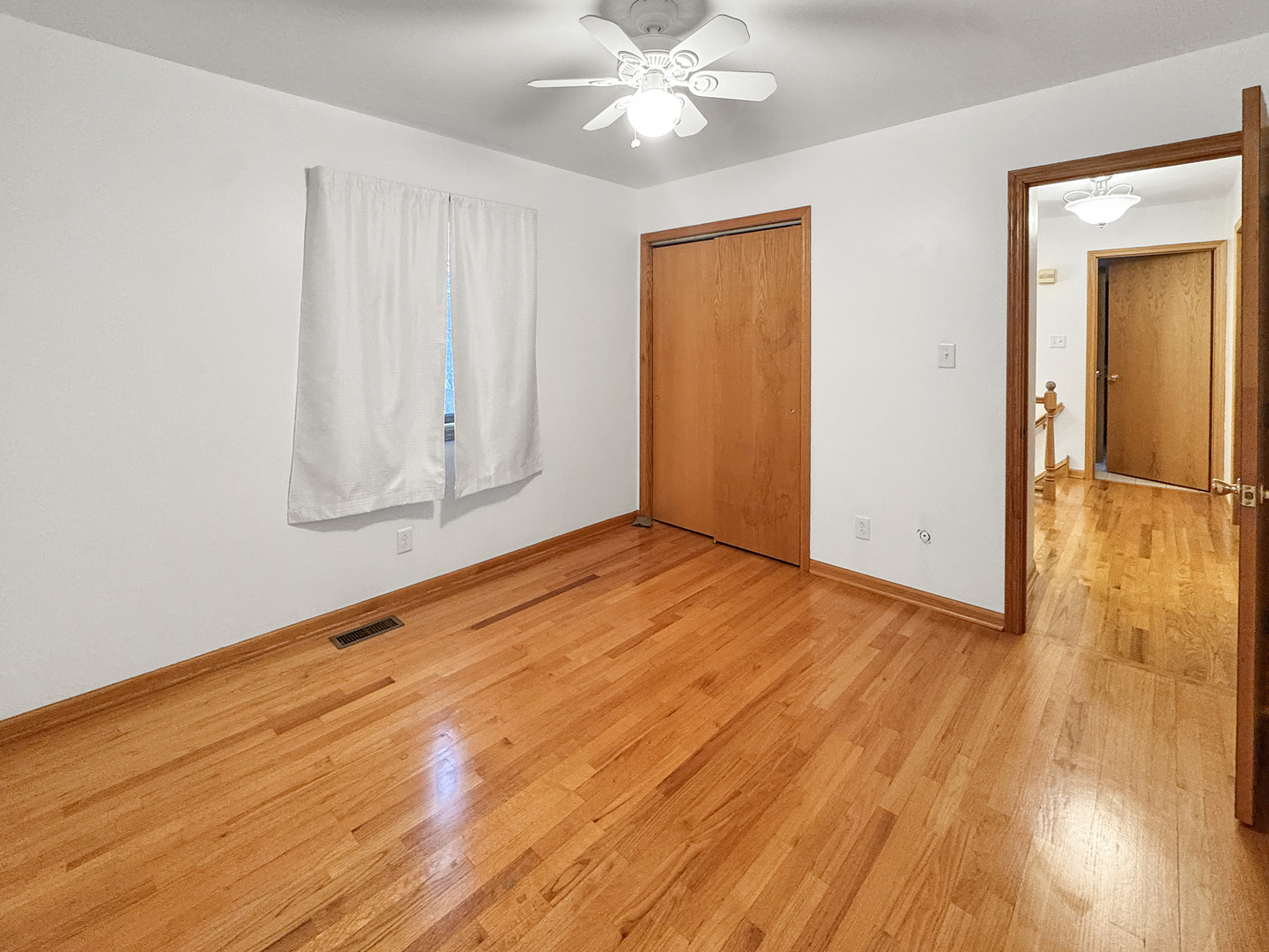 1105 Summit Drive Lockport, IL 60441 - Photo 15 of 15 an empty room with wooden floor closet and windows