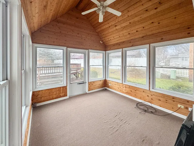 a view of an empty room with a balcony