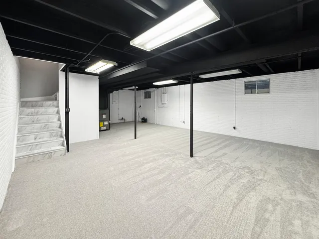 a kitchen with stainless steel appliances a refrigerator sink and microwave