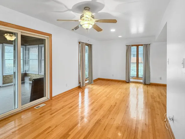a view of a room with wooden floor