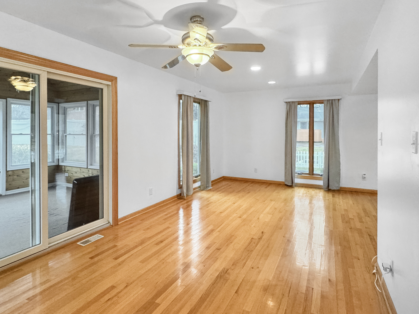 1105 Summit Drive Lockport, IL 60441 - Photo 9 of 15 a view of an empty room with a window and wooden floor
