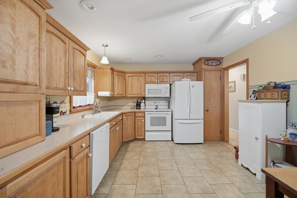 5 Westview Terrace Easthampton, MA 01027 - Photo 12 of 39 a kitchen with a sink a refrigerator and cabinets