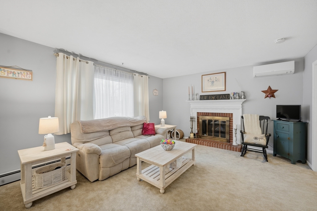 5 Westview Terrace Easthampton, MA 01027 - Photo 13 of 39 a living room with furniture and a fireplace