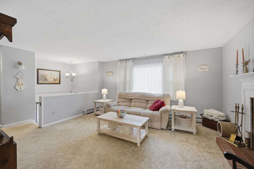 5 Westview Terrace Easthampton, MA 01027 - Photo 14 of 39 a living room with furniture and a window