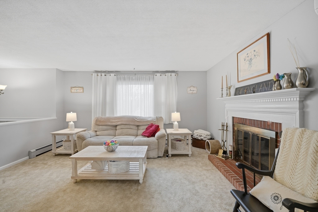 5 Westview Terrace Easthampton, MA 01027 - Photo 15 of 39 a living room with furniture and a fireplace