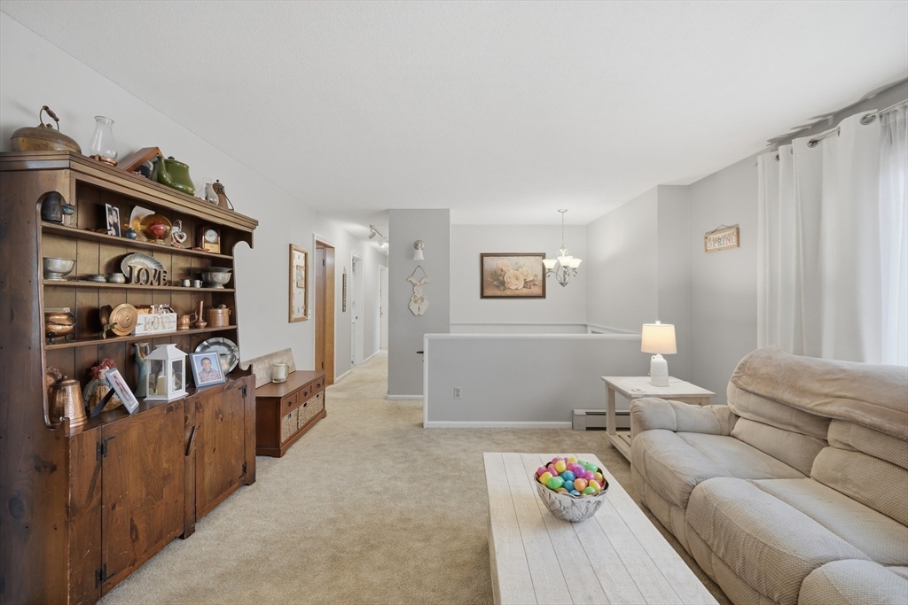 5 Westview Terrace Easthampton, MA 01027 - Photo 16 of 39 a living room with furniture and a book shelf