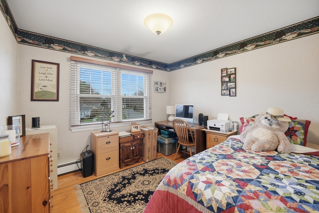 5 Westview Terrace Easthampton, MA 01027 - Photo 20 of 39 a bedroom with a bed and wooden floor