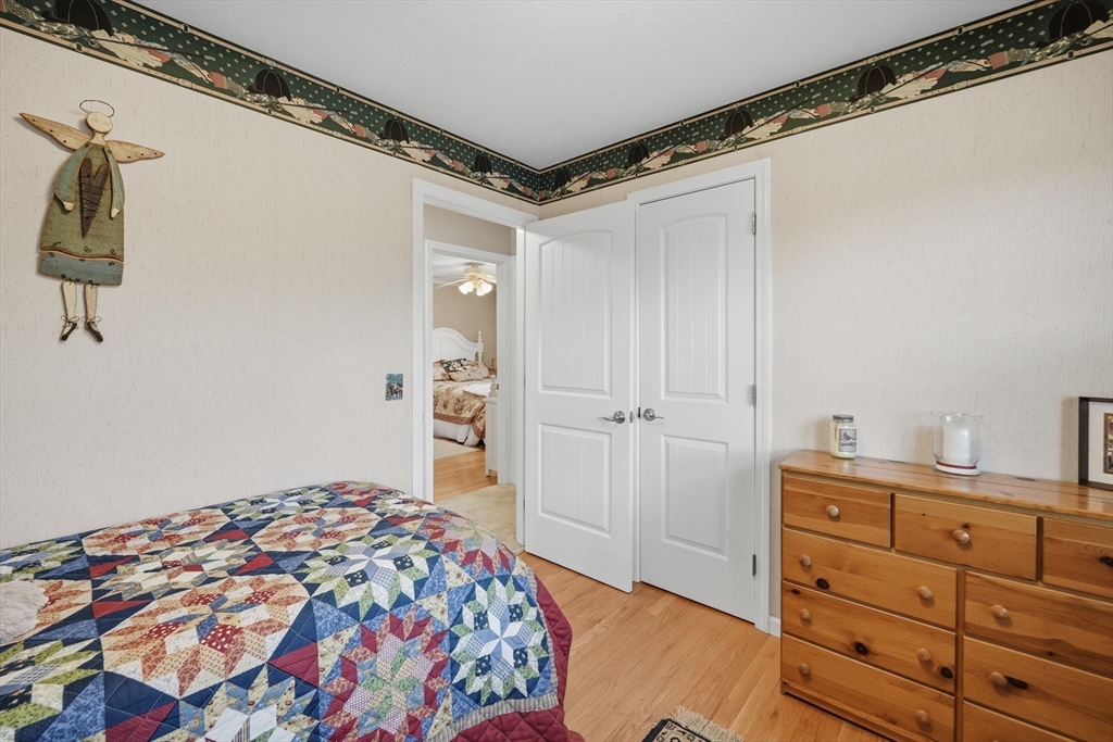 5 Westview Terrace Easthampton, MA 01027 - Photo 21 of 39 a bedroom with a bed and a cabinets