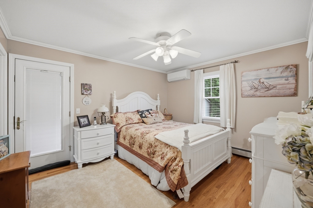 5 Westview Terrace Easthampton, MA 01027 - Photo 22 of 39 a bedroom with a bed and a chandelier