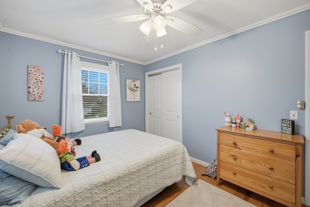 5 Westview Terrace Easthampton, MA 01027 - Photo 27 of 39 a bedroom with a bed and a chandelier