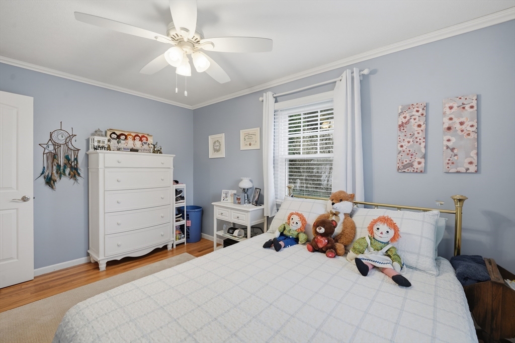 5 Westview Terrace Easthampton, MA 01027 - Photo 28 of 39 a bedroom with a bed and a chandelier