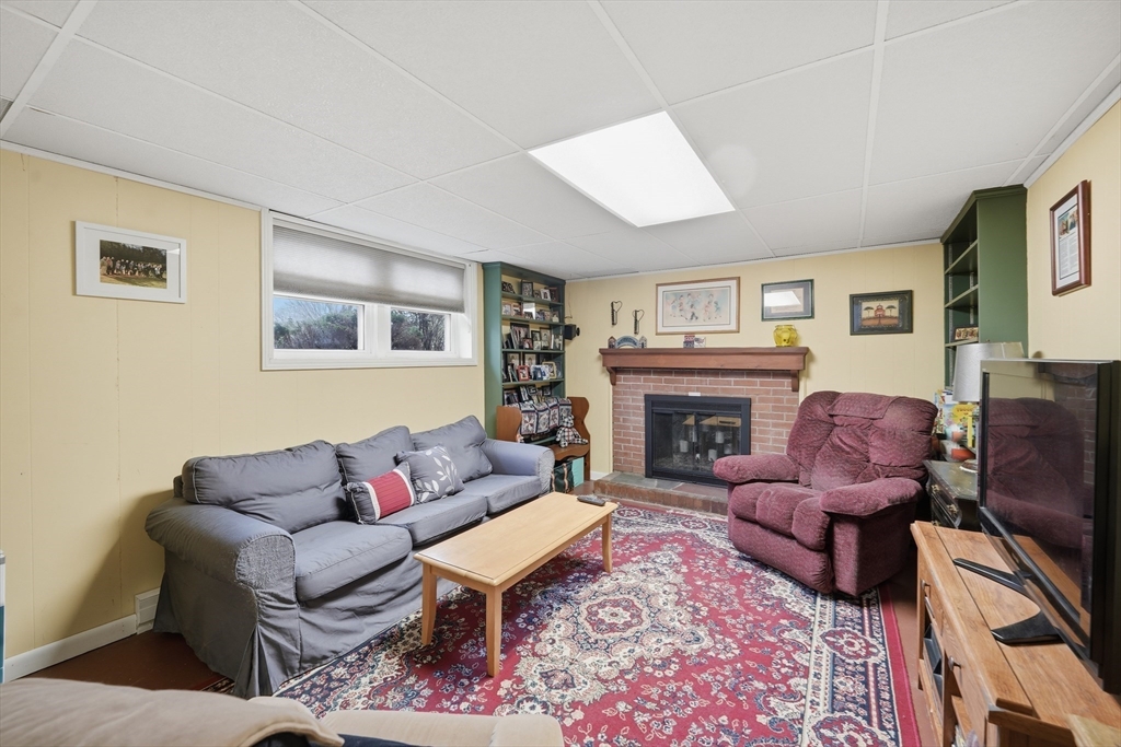 5 Westview Terrace Easthampton, MA 01027 - Photo 29 of 39 a living room with furniture and a fireplace