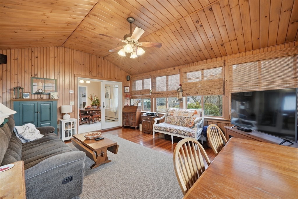 5 Westview Terrace Easthampton, MA 01027 - Photo 5 of 39 a living room with furniture a fireplace and a floor to ceiling window