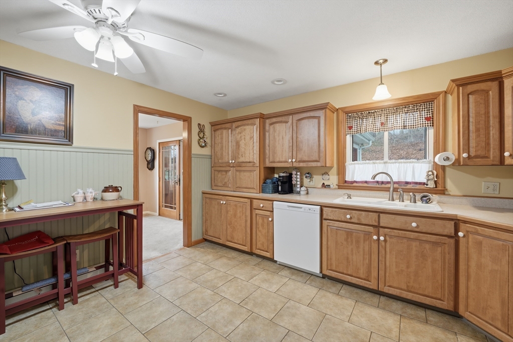 5 Westview Terrace Easthampton, MA 01027 - Photo 10 of 39 a kitchen with sink cabinets and window