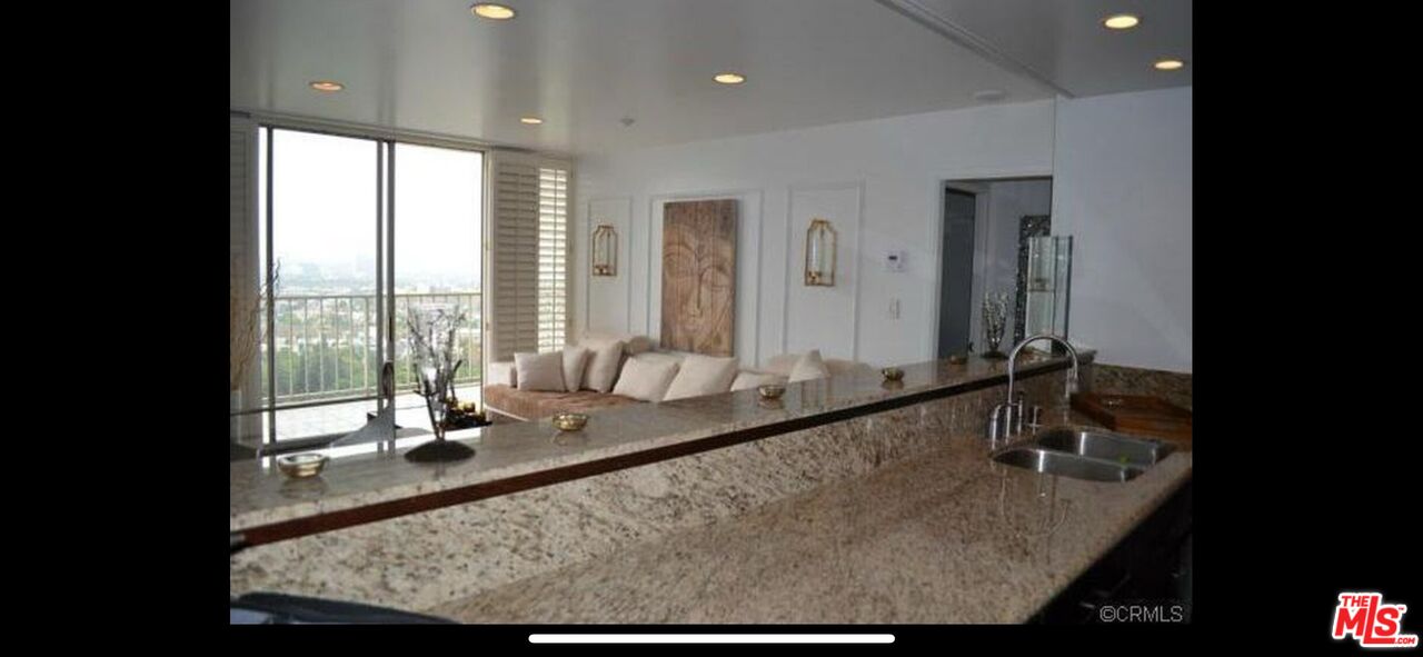 2170 Century Park East, Unit 1611 Los Angeles, CA 90067 - Photo 12 of 41 a view of a living room and a window