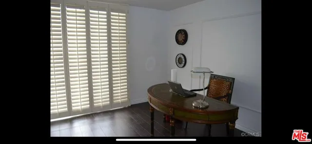 a view of a room that has a couch and a window