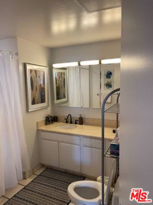 2170 Century Park East, Unit 1611 Los Angeles, CA 90067 - Photo 18 of 41 a bathroom with a sink and mirror