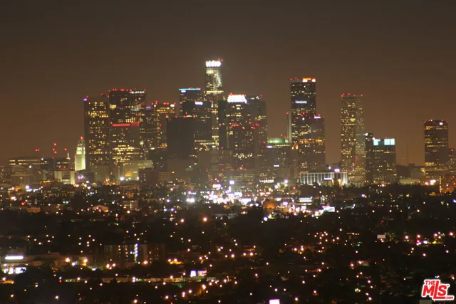 a view of city with sunset