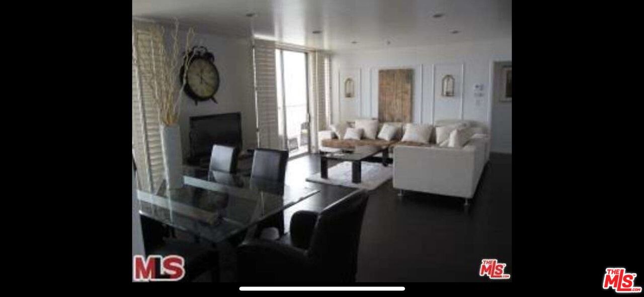 2170 Century Park East, Unit 1611 Los Angeles, CA 90067 - Photo 8 of 41 a living room with furniture and a fireplace