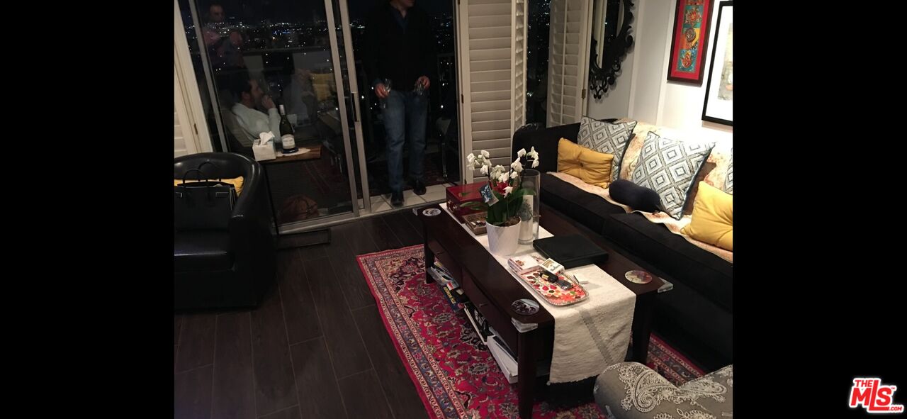 2170 Century Park East, Unit 1611 Los Angeles, CA 90067 - Photo 10 of 41 a living room with furniture and a potted plant