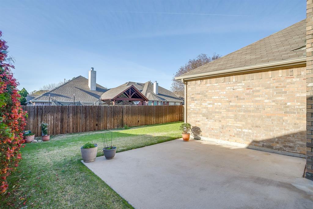 8105 Hosta Way Fort Worth, TX 76123 - Photo 29 of 33 a view of a house with a yard and a yard