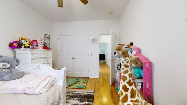 a bedroom with a bed and a dresser in it