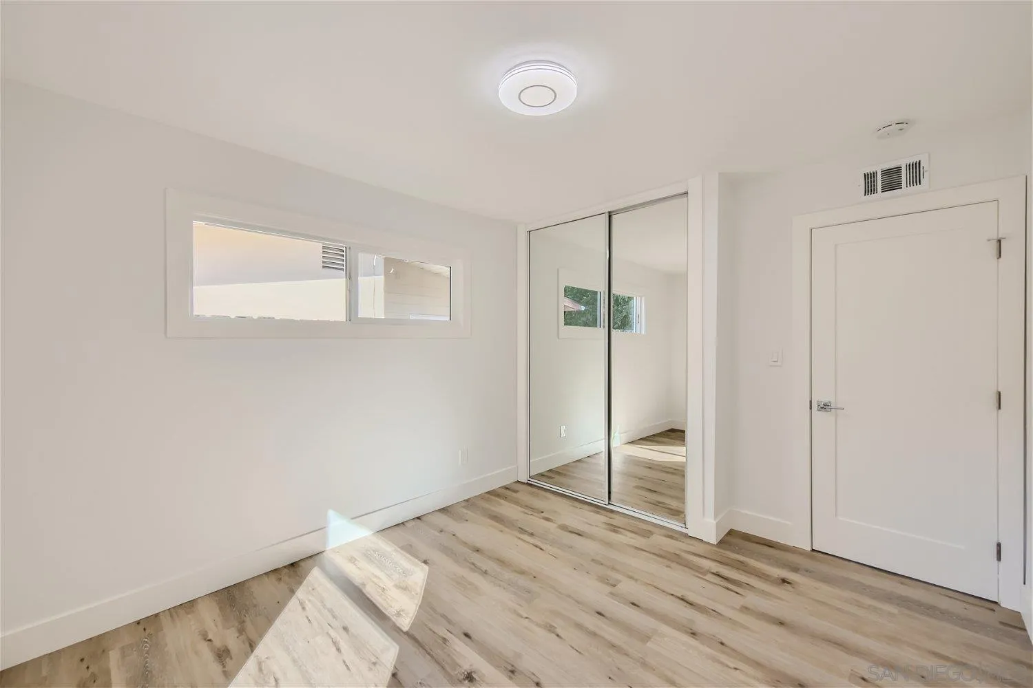 14222 Halper Road Poway, CA 92064 - Photo 13 of 30 a view of empty room with wooden floor