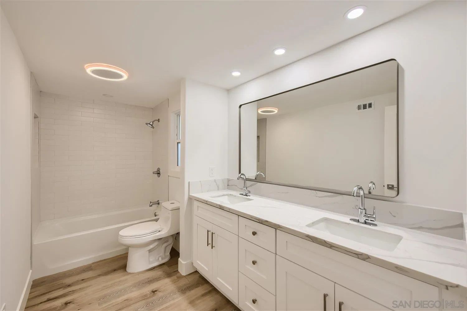 14222 Halper Road Poway, CA 92064 - Photo 16 of 30 a bathroom with a granite countertop sink a toilet and a bathtub