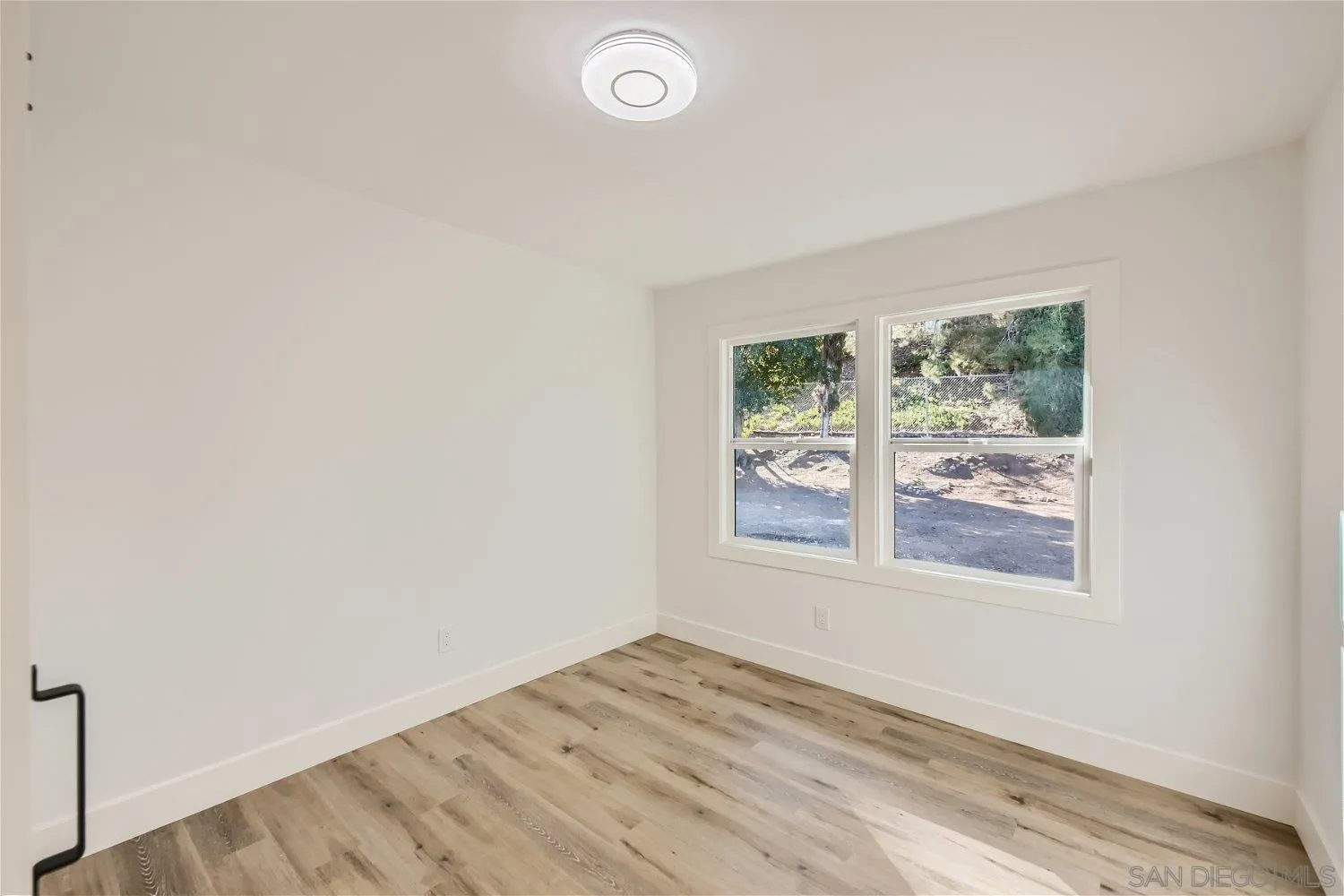 14222 Halper Road Poway, CA 92064 - Photo 20 of 30 an empty room with a window