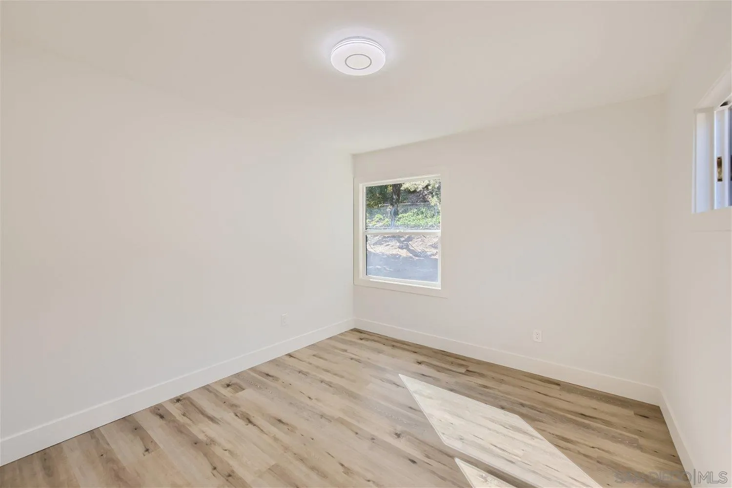 14222 Halper Road Poway, CA 92064 - Photo 23 of 30 an empty room with a workbench