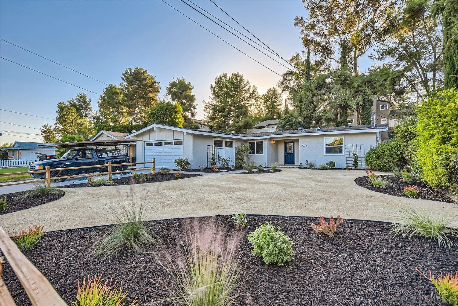 14222 Halper Road Poway, CA 92064 - Photo 30 of 30 a front view of a house with a yard and a garden