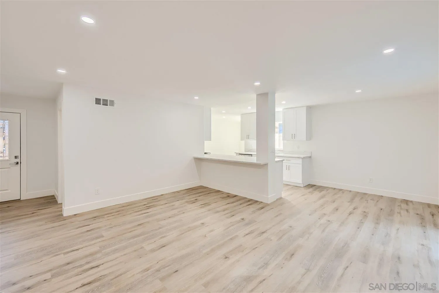 14222 Halper Road Poway, CA 92064 - Photo 4 of 30 a view of empty room with wooden floor