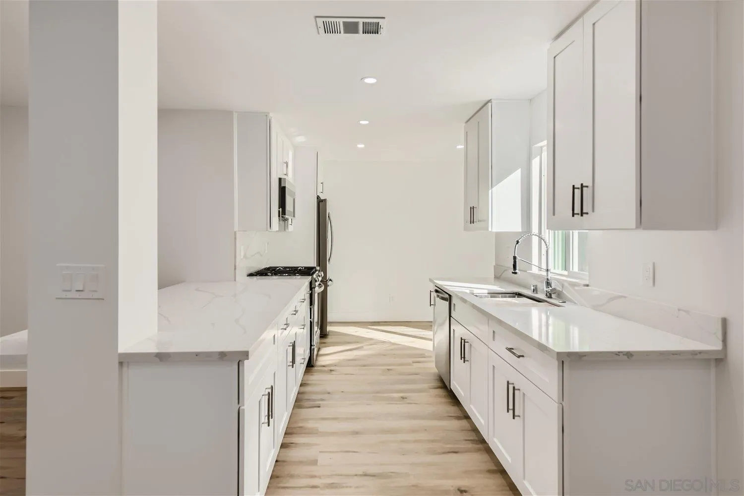 14222 Halper Road Poway, CA 92064 - Photo 7 of 30 a bathroom with a double vanity sink and a mirror