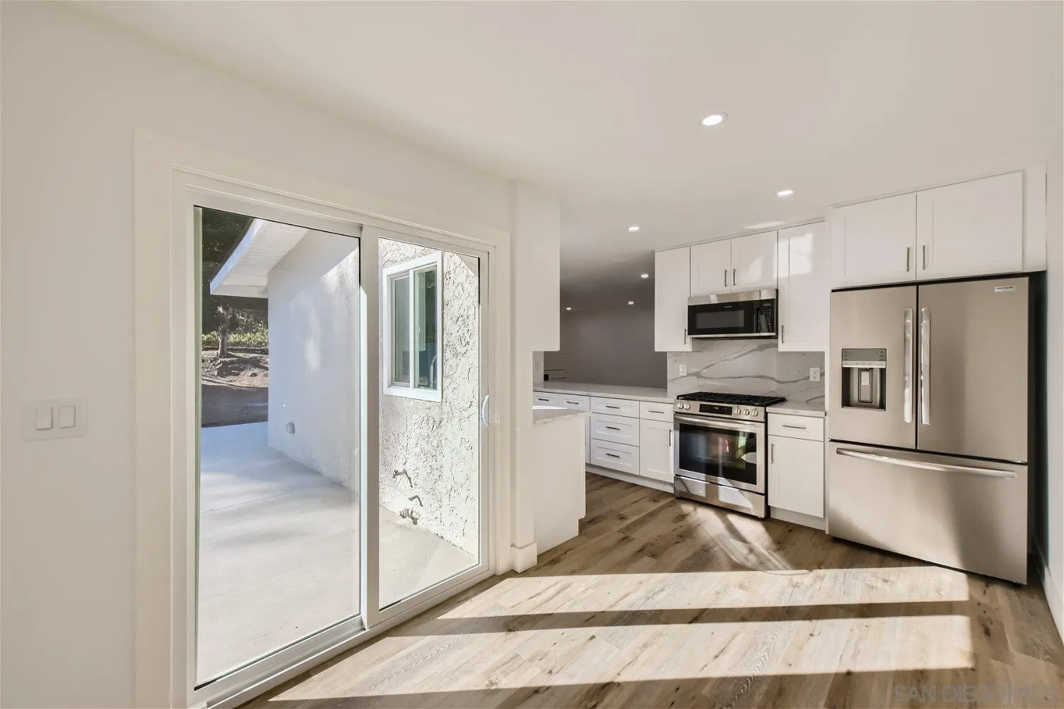14222 Halper Road Poway, CA 92064 - Photo 10 of 30 a view of kitchen with refrigerator stove microwave and cabinets