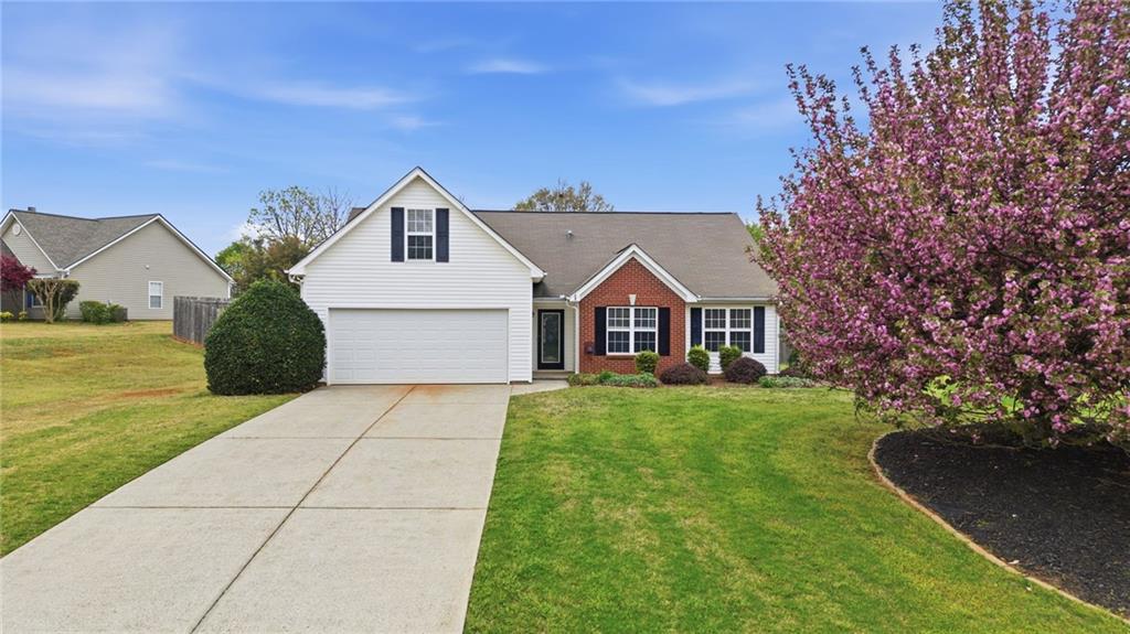 5828 Meadowfield Trace Flowery Branch, GA 30542 - Photo 1 of 1 a front view of a house with yard