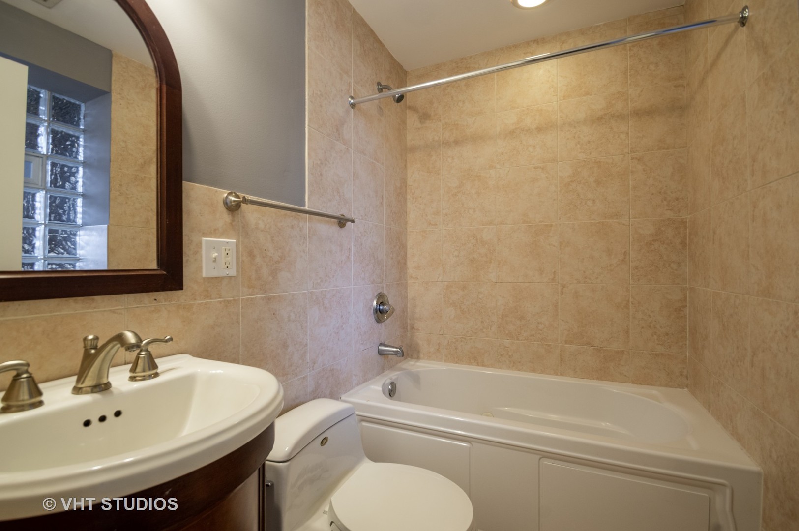 4855 North Drake Avenue, Unit 1 Chicago, IL 60625 - Photo 4 of 20 a bathroom with a sink toilet and shower