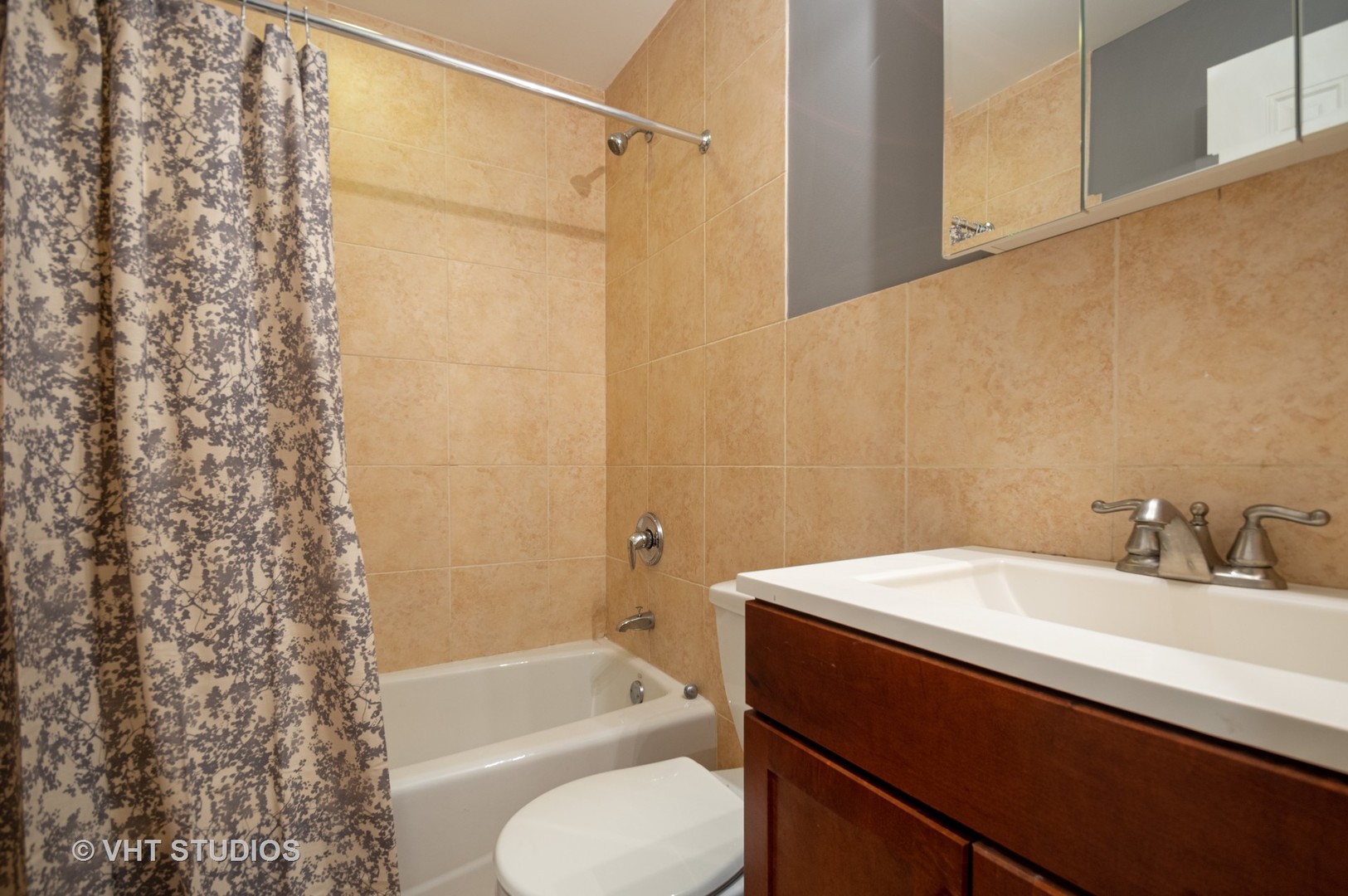 4855 North Drake Avenue, Unit 1 Chicago, IL 60625 - Photo 10 of 20 a bathroom with a sink toilet and shower