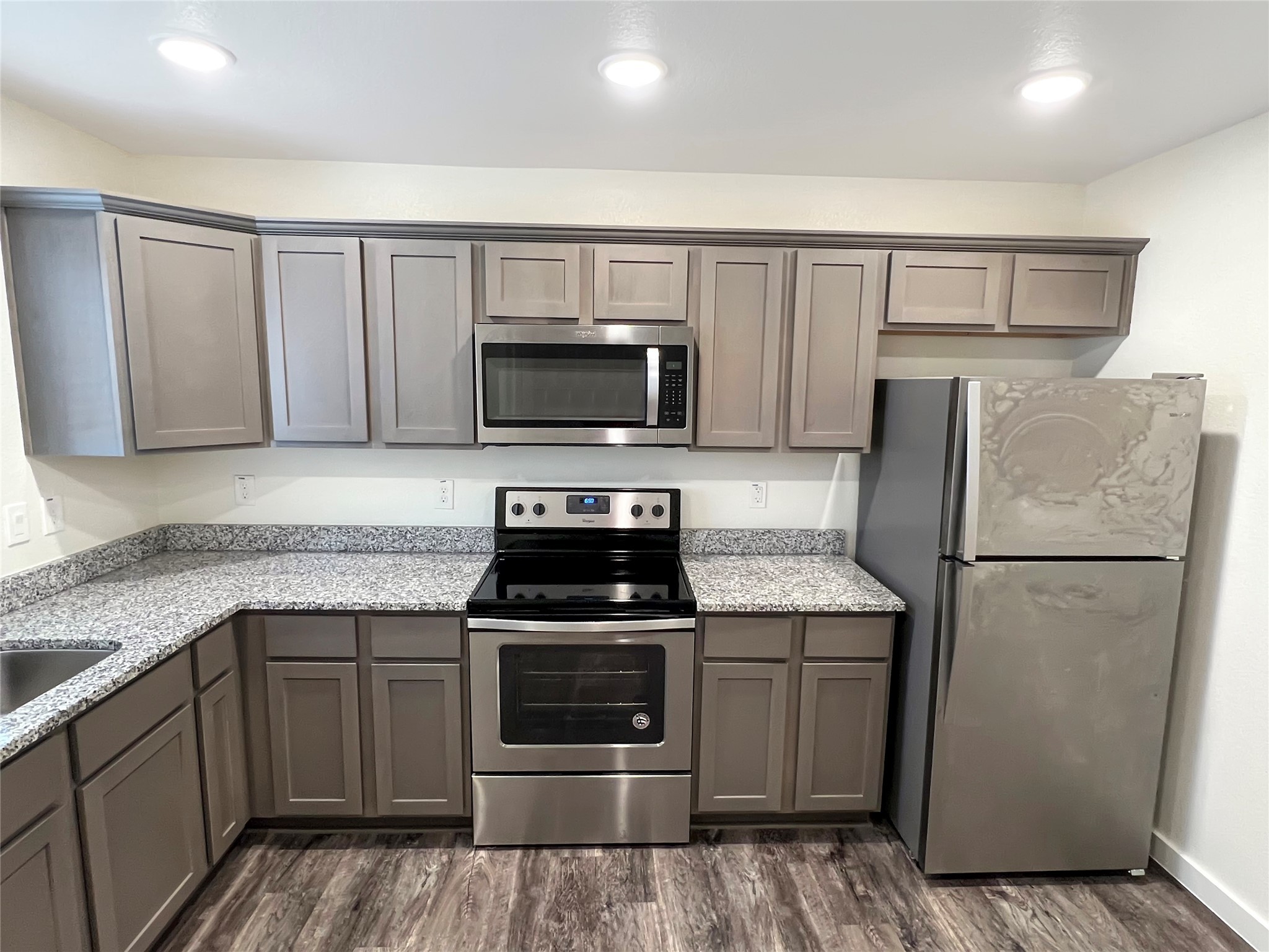 21155 Gosling Road, Unit 48 AD Spring, TX 77388 - Photo 11 of 20 a kitchen with a sink stove and refrigerator